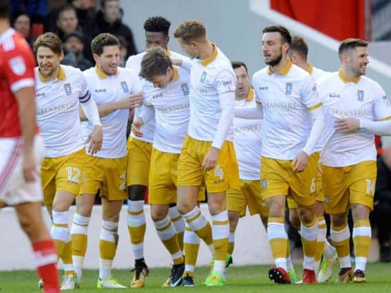 Adam Reach is congratulated by his team mates after opening the scoring at Nottingham Forest