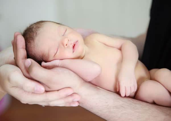 A Generic Photo of the hands of a mother and father holding their newborn baby. See PA Feature FAMILY Home Birth. Picture credit should read: PA Photo/thinkstockphotos. WARNING: This picture must only be used to accompany PA Feature FAMILY Home Birth.