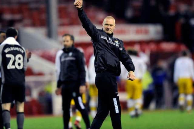 Lee Bullen gives a thumbs up to fans after victory over Nottingham Forest