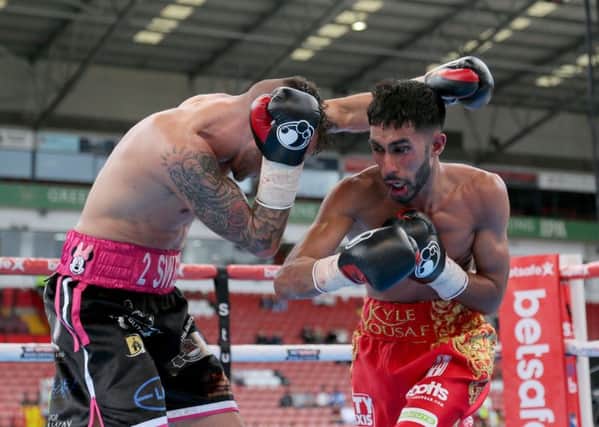 Kyle Yousaf (right) in action against Louis Norman during their Super-Flyweight contest at Bramall Lane, Sheffield in May.