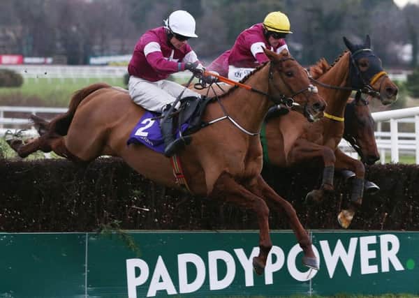 Road To Respect ridden by Sean Flanagan (right) clears the last on the way to winning the Leopardstown Christmas Steeplechase. Photo: Brian Lawless/PA Wire