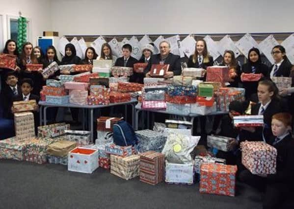 Pupils from Oakwood High School, on Moorgate Road in Rotherham, filled 136 shoeboxes with essential toiletries, clothing and nonperishable food and then gave them to  local charity Shiloh, which offers support for  adults in need. Pupils are pictured with some of the shoeboxes.