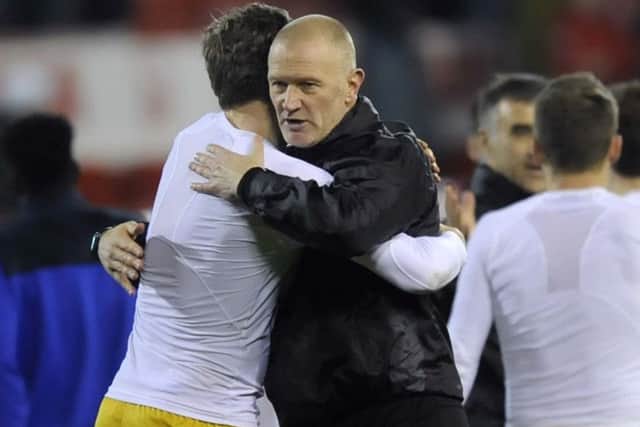 Victory hug from Lee Bullen for Adam Reach....Pic Steve Ellis