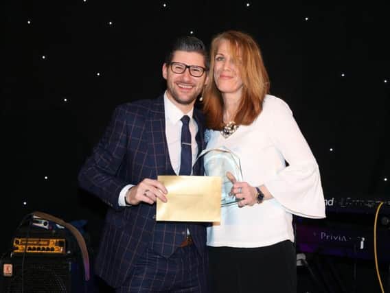 Care worker Heather Sherratt collects her award
