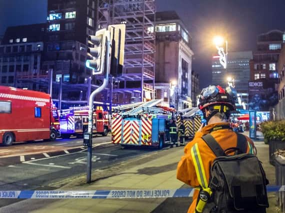 Emergency services at the scene of a fire at a 12-storey building in the Northern Quarter of Manchester. PRESS ASSOCIATION Photo. Picture date: Saturday December 30, 2017. Images posted on social media show smoke billowing out of the building on Joiner Street in the city, while crowds of people watch on from below.  Photo: Danny Lawson/PA Wire