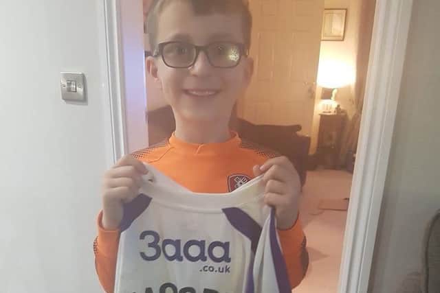 Young Jack Topham with Kieffer Moore's shirt