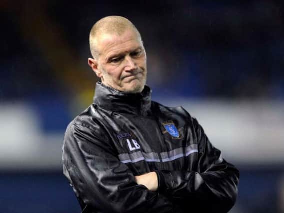 Sheffield Wednesday's stand-in boss Lee Bullen shows his dejection on the sidelines during the Owls' 3-0 defeat to Burton Albion