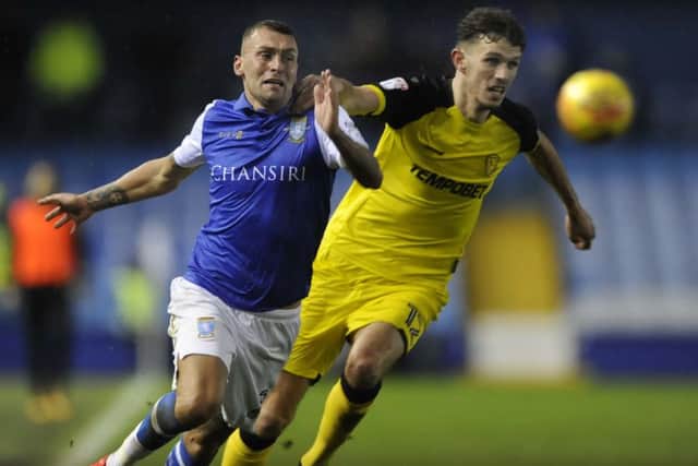Owls Jack Hunt tries to pass Albions Tom Flanagan....Pic Steve Ellis