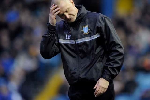 Lee Bullen cuts a dejected figure during Sheffield Wednesday's 3-0 defeat to Burton Albion
