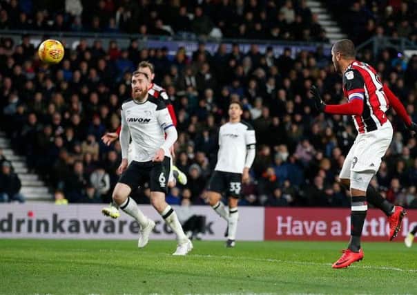 Leon Clarke rises to head in Sheffield United's equaliser against Derby County.