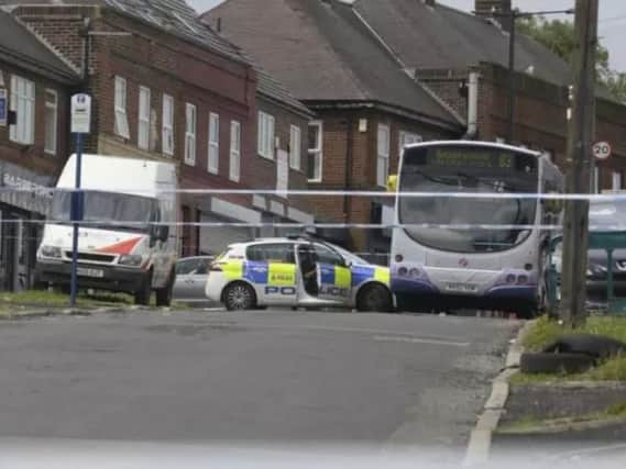 Police officers sealed off Longley Avenue West after a shooting last July