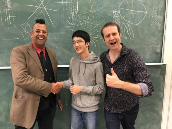 Who Wants to Be a Mathematician UK champion Yuji Okitani with Simon Singh, chairman of the Good Thinking Society, and Matt Parker, who hosted the UK final