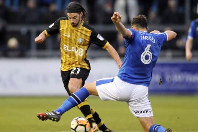 Owls George Boyd skips past utds Tom Parkes....Pic Steve Ellis