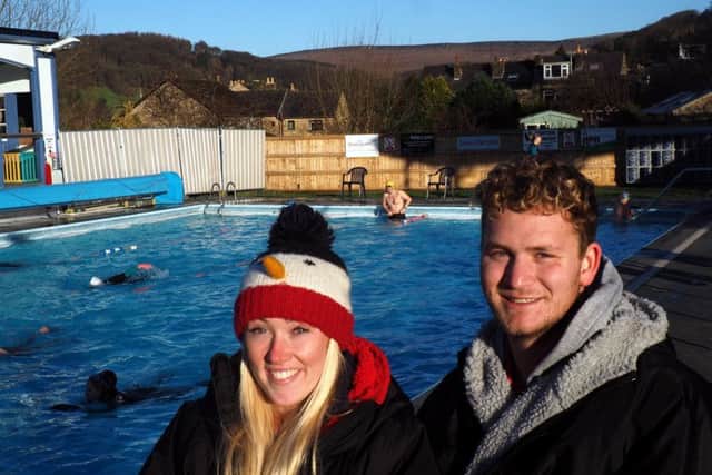 Hathersage Swimming Pool winter public opening: lifeguard Lucy Wilman and pool assistant manager George Foy by the busy pool