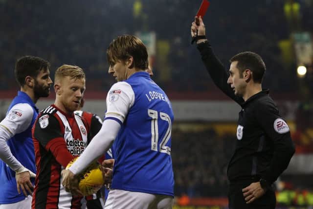 Owls skipper Glenn Loovens is sent off after a second yellow card in the Steel City derby