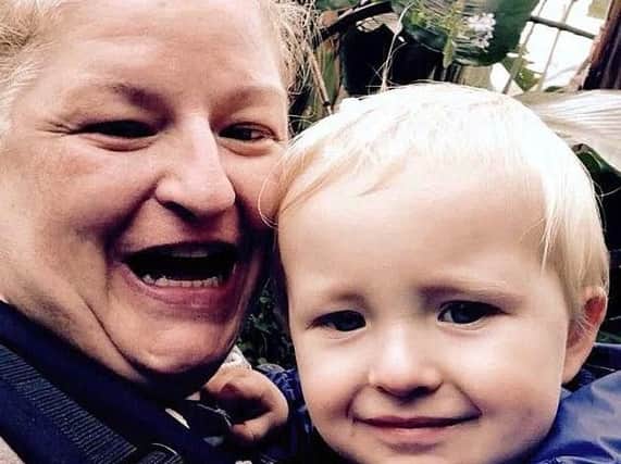 Joanne Curren with son Noah. (Photo: SWNS).
