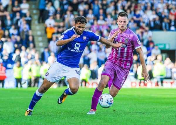 Chesterfield's forward Delial Brewster (18) burst past Grimsby Town's midfielder James Berrett (7).

Picture by Stephen Buckley/AHPIX.com. Football, League 2, Chesterfield v Grimsby Town; 05/08/2017 KO 3.00pm 
Proact; copyright picture; Howard Roe; 07973 739229