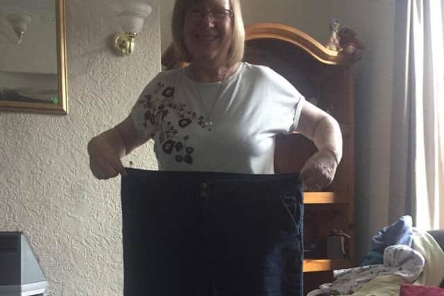 Helen with an old pair of trousers.