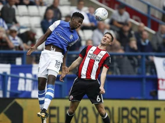 Lucas Joao and Chris Basham in action during the last derby clash at Hillsborough in September