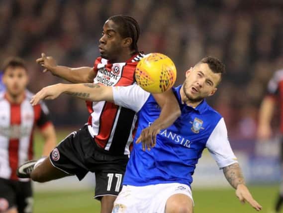 Daniel Pudil (right) battles with Clayton Donaldson in Friday night's Sheffield derby