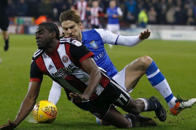 Glenn Loovens saw red for two fouls on Clayton Donaldson