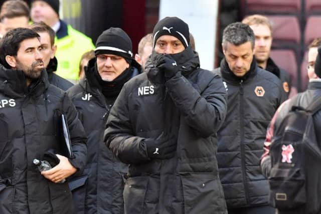 Nuno Espirito Santo wrapped up warm for the South Yorkshire weather at Oakwell