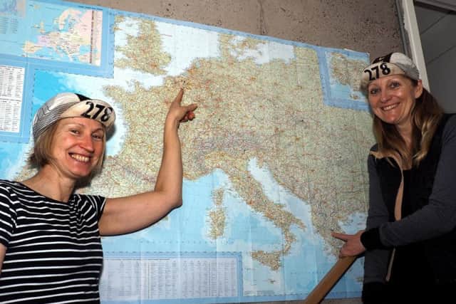 Angela Walker (blonder hair) and Julie Bullen back home in Sheffield after the Transcontinental cycle race with a map of their route across Europe