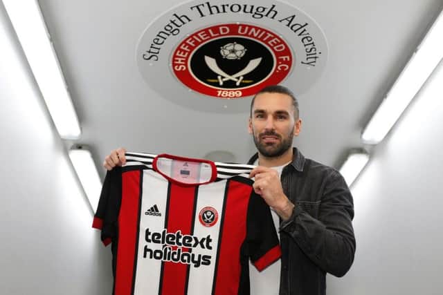 Ricky Holmes at his Blades unveiling