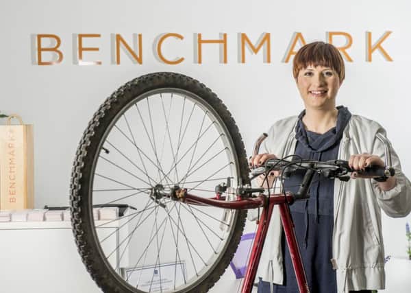 Rebecca Morris, Operations Manager at Benchmark Recruit in Sheffield with the bike donated to the Archer Project, a charity that works with people who are homeless or at risk from homelessness.