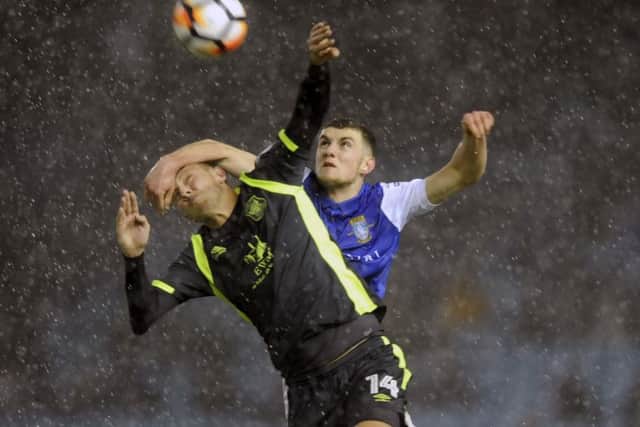 Owls youngster Connor O'Grady beats Utds Richie Bennett.....Pic Steve Ellis