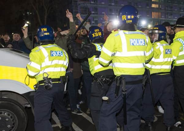 Riot police keep fans apart on Bramall Lane on Friday night