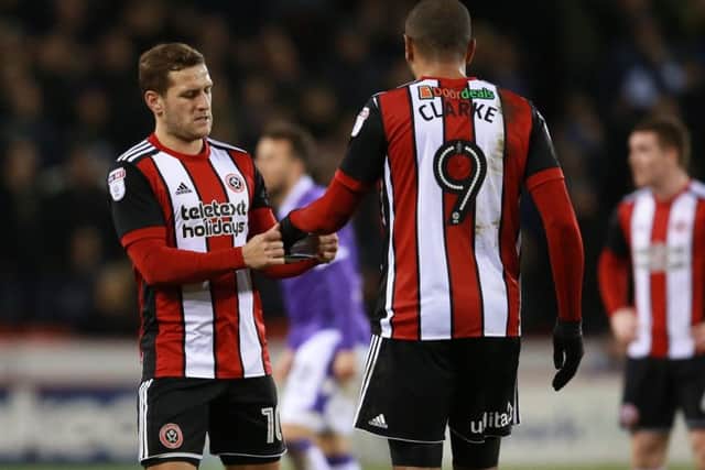 Billy Sharp gives the captains armband to Leon Clarke: Simon Bellis/Sportimage