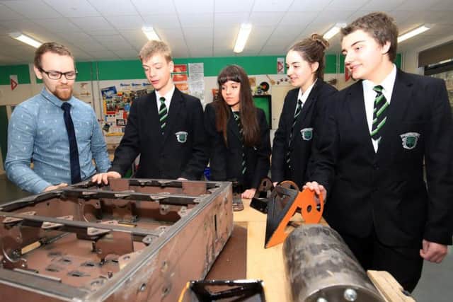 Teacher Daniel Grant with James Maiklem, Freya Foster, Eleanor Brook and Theo Cruddace who are working on building a robot to take part in Robot Wars
