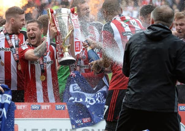 Billy Sharp captained United to the League One title last season