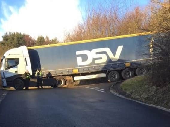The lorry driver ended up blocking the road after failing to negotiate a tricky corner (photo: South Yorkshire Police)