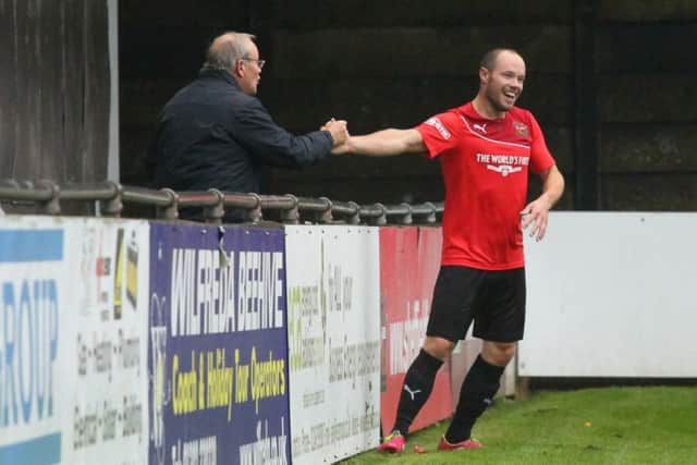 Matt Roney celebrates his first Sheffield FC hat-trick with his dad