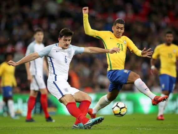 Sheffield's Harry Maguire in action here against Brazil, could now have a date with Spain on the horizon with England. Picture: Press Association