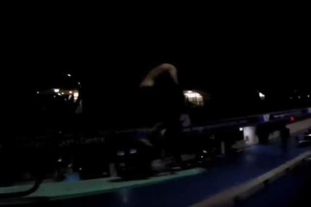 A man was captured riding a bike into the pool at Ponds Forge from a diving board