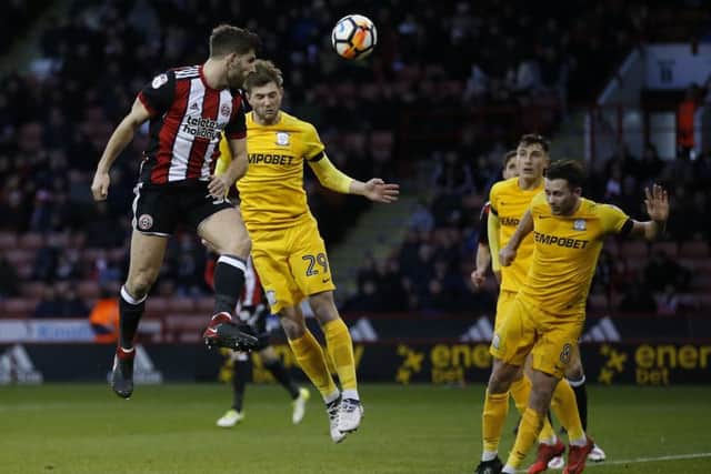 Ched Evans heads for goal