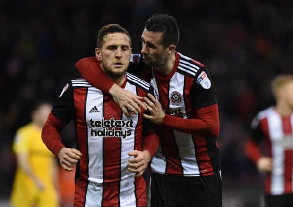 Billy Sharp and Danny Lafferty celebrate after the skipper's winning goal ensured FA Cup progress for Sheffield United