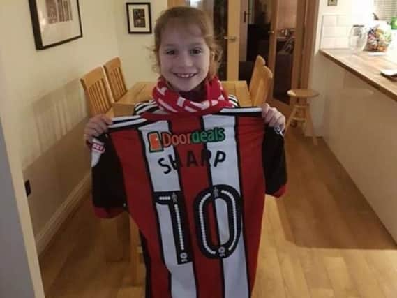 A beaming Georgia with Billy Sharp's shirt