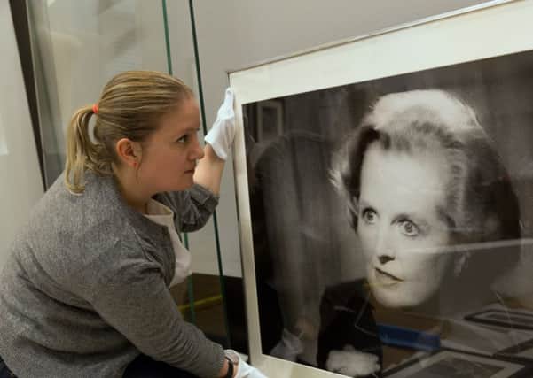 Project Curator  Louisa Briggs installing  Paul Trevor, Margaret Thatcher, on Television,  at Changing Lives: 200 Years of People and Protest in Sheffield at Weston Park Museum
 Â© Museums Sheffield