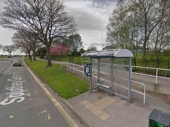 Police officers taped off a bus shelter in Sheffield this morning
