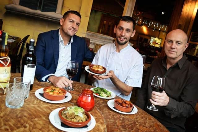 Adrian Bagnoli and Brad Charlesworth, co-owners, pictured with Head Chef Erkland Xhaja, with a selection of dishes from their Hot Tapas menu. Picture: Marie Caley