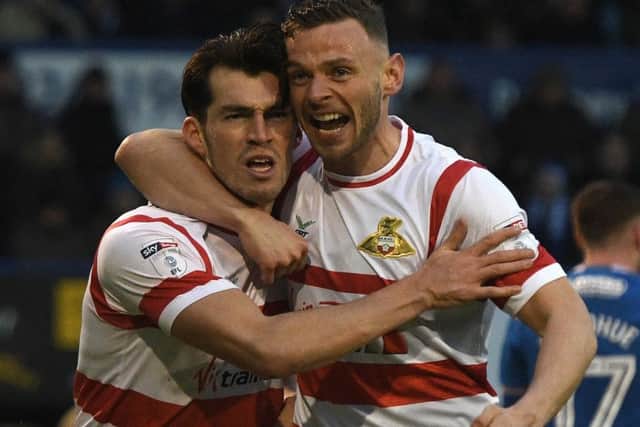 Doncaster's John Marquis (l) celebrates his goal with Andy Boyle