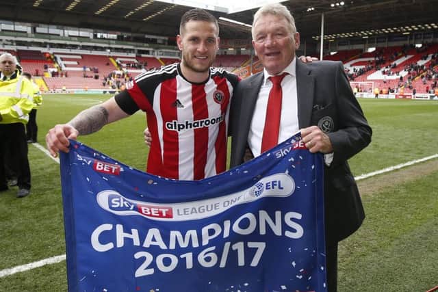 Officially the club's greatest ever player, Currie celebrates last season's promotion with captain Billy Sharp: Simon Bellis/Sportimage