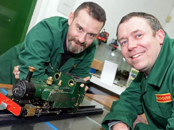 Harry Harrison and Chris Lee, of Roundhouse Engineering Co, pictured with the locomotive that has featured on a television programme. Picture: Marie Caley NDFP Train MC 2