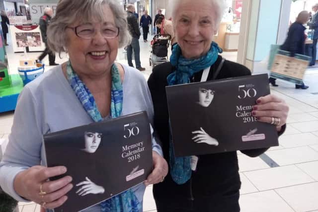 Georgina Mullis and Judy Bowers with their Doncaster Cancer Detection Trust calendars