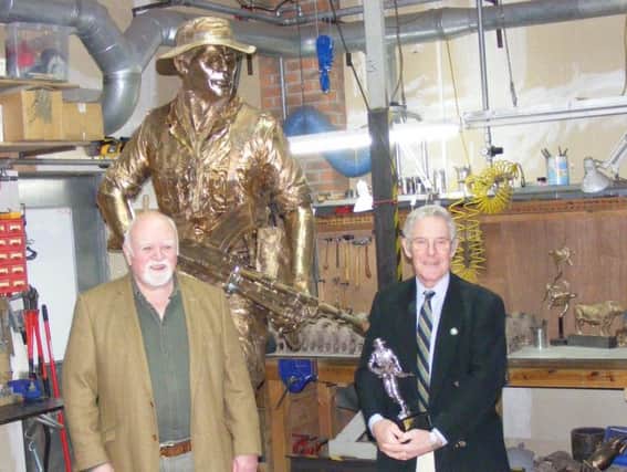 The completed Kings Own Yorkshire Light Infantry statue which will be placed in Elmfield Park, Doncaster. It is pictured with KOYLI fundraisers Percy Potts and  Dave Wroe