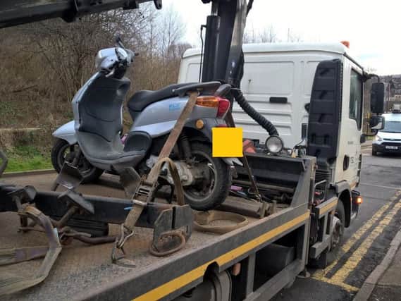 The moped was seized after it was found to have no tax or insurance (photo: South Yorkshire Police)